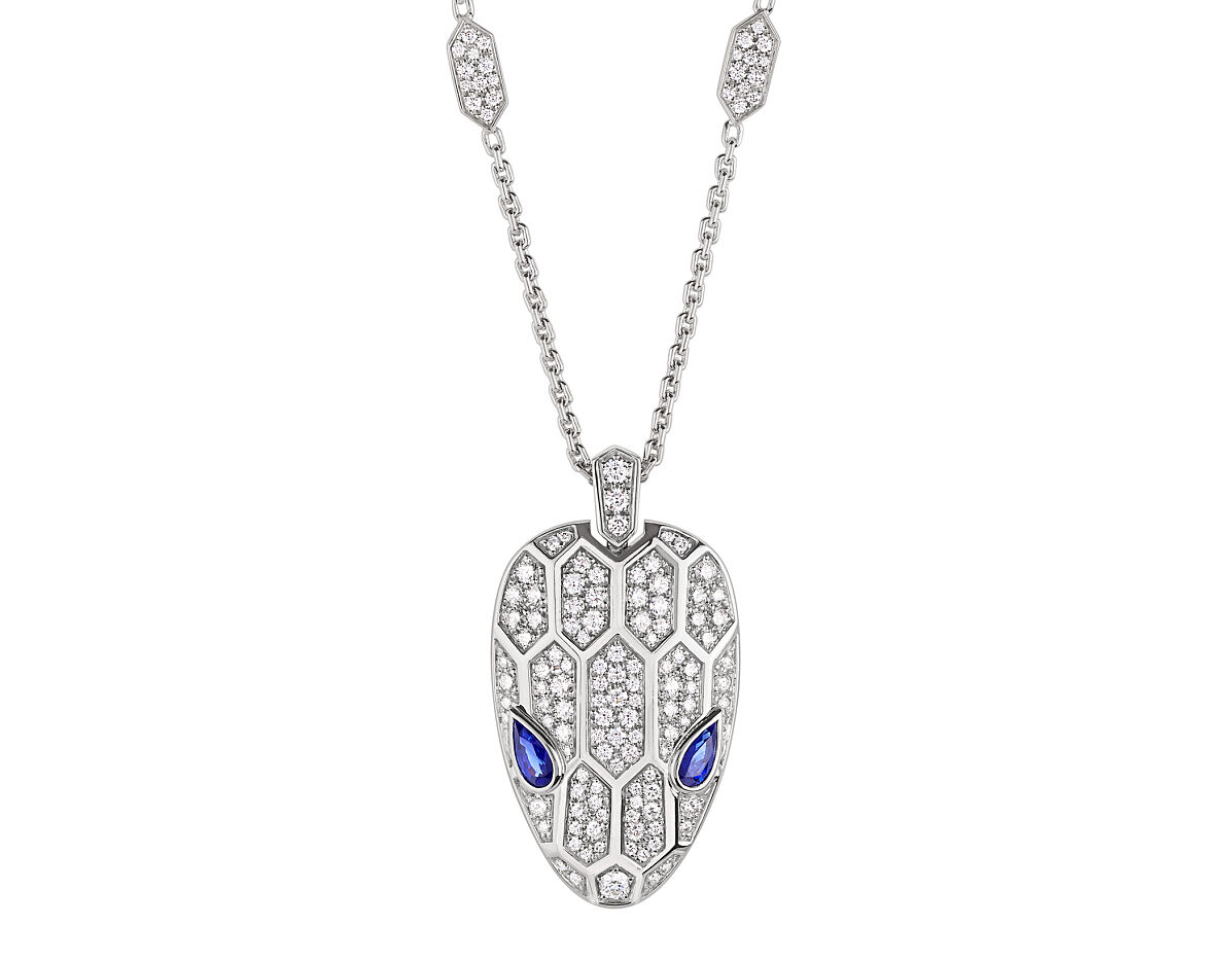 Serpenti 18 kt white gold pendant necklace set with blue sapphire eyes and pavé diamonds on the chain and head.